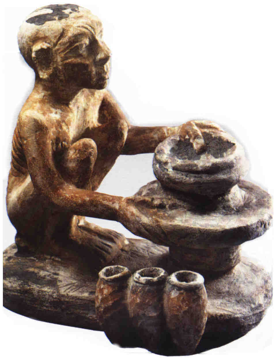 Statuette de bois polychrome représentant un potier égyptien -  Gizeh Vè dynastie