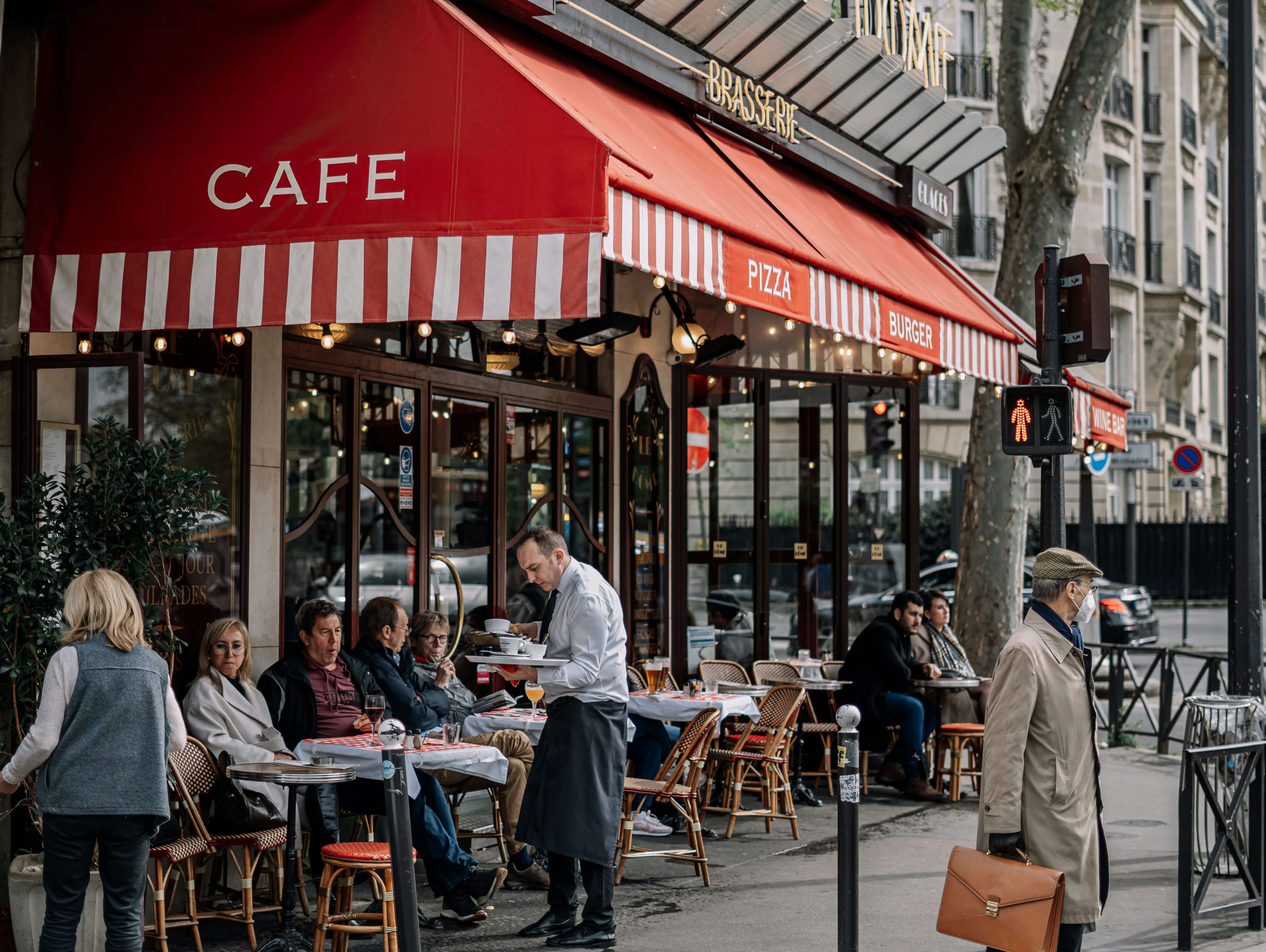 Eating on restaurant terrace in Paris