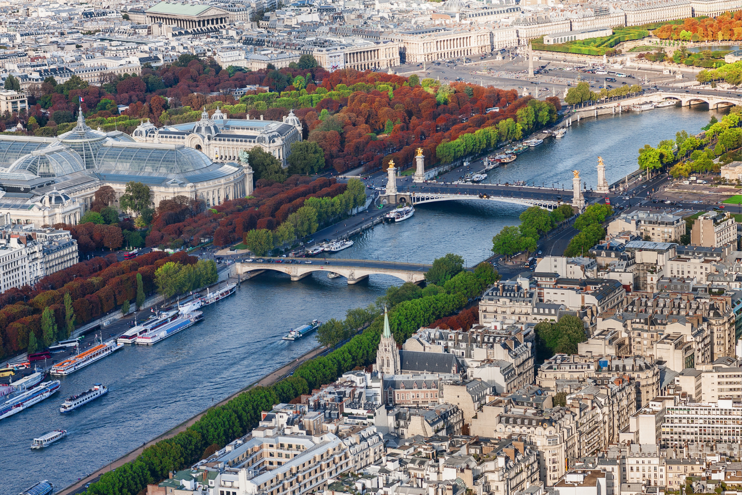 View of the Right Bank of Paris with the Seine River, Pont Alexandre III, and iconic landmarks such as the Grand Palais, perfect for exploring luxury apartments and cultural highlights in the City of Lights.