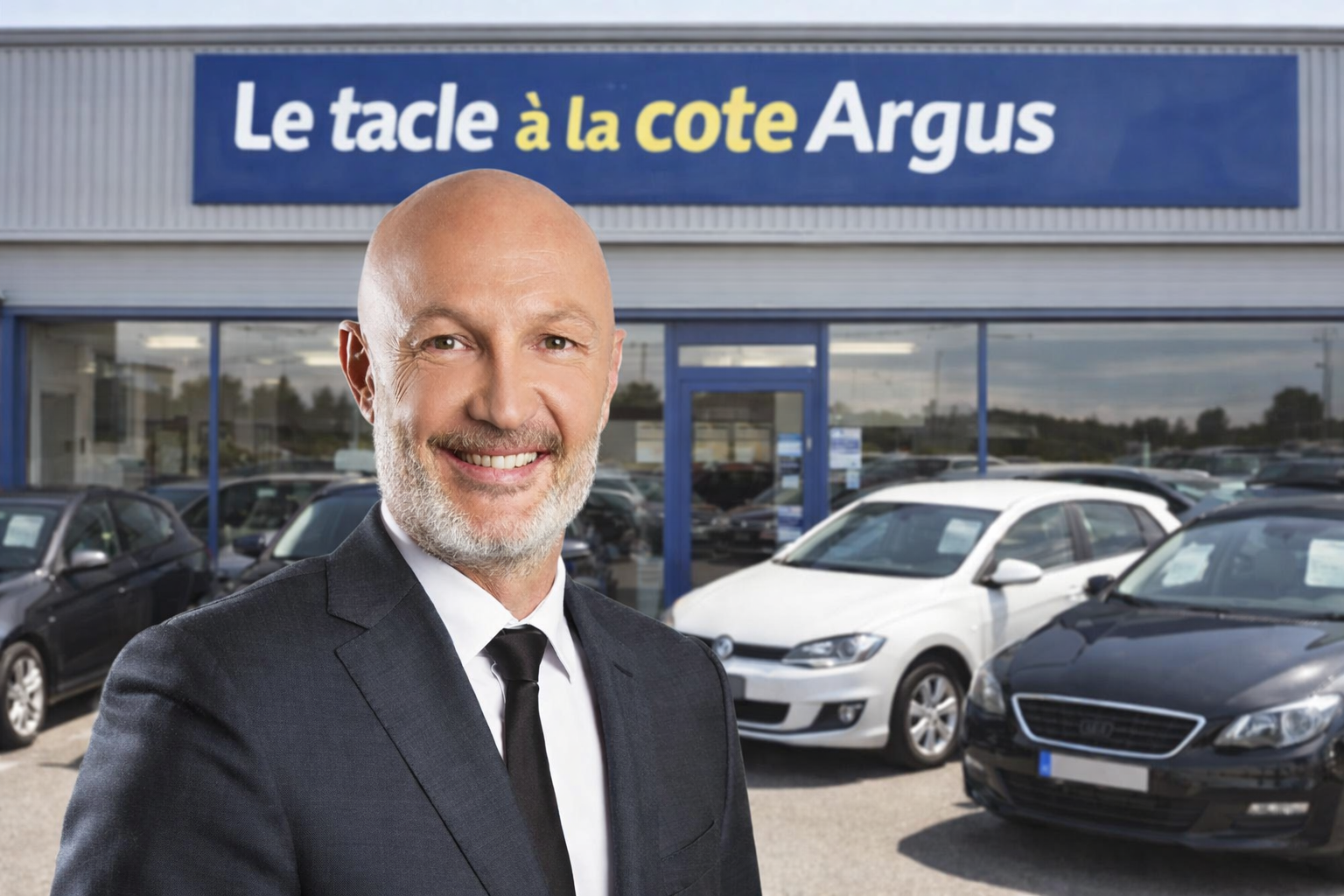 Frank Leboeuf pose fièrement devant son nouveau garage automobile